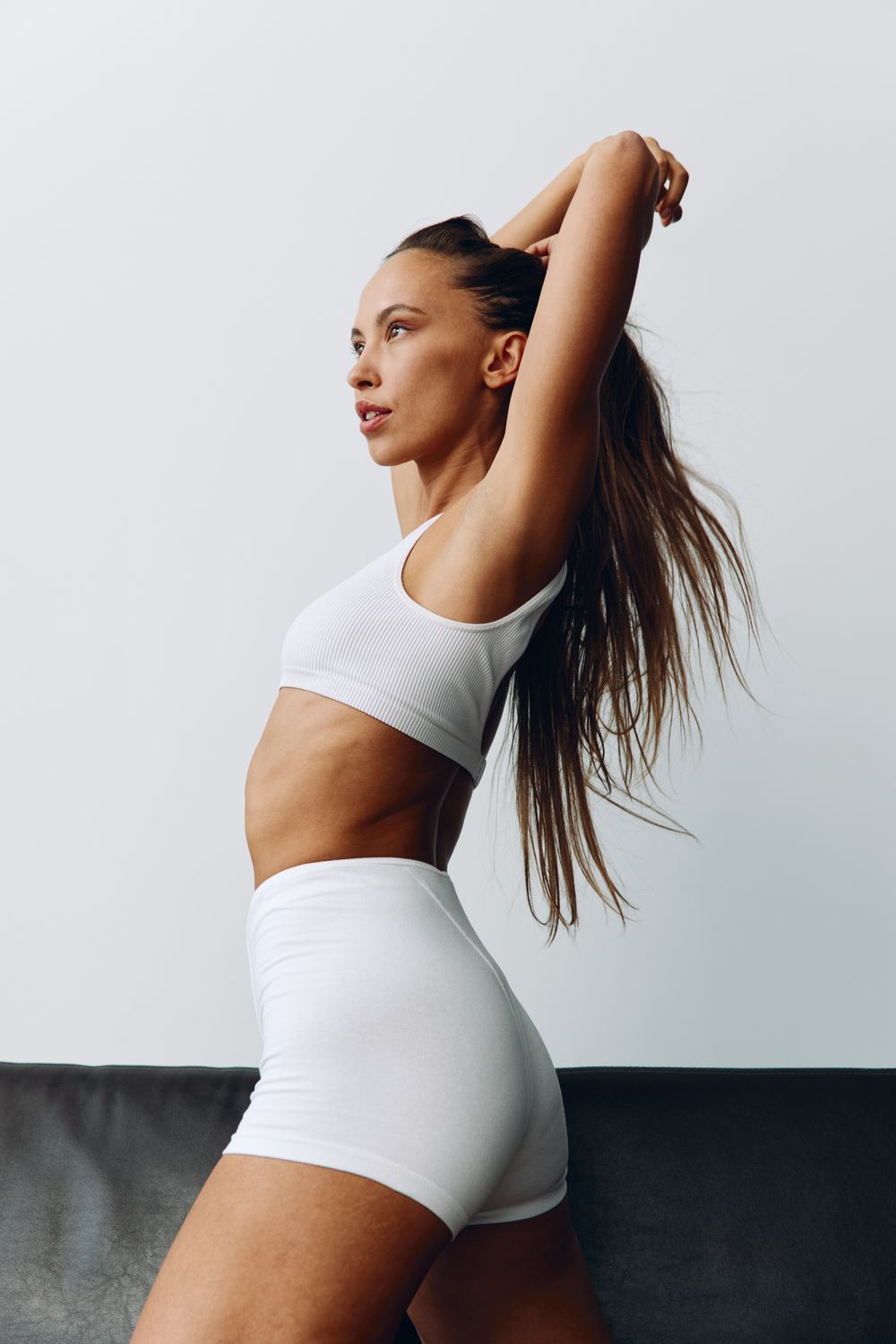 Couple embracing joyfully in a warm moment.